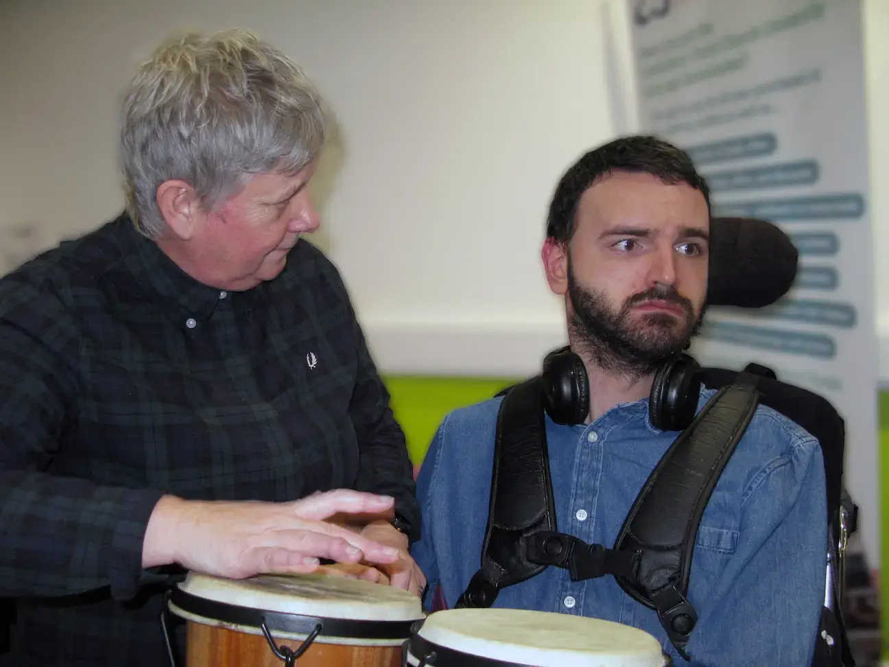 3) Support worker and young person using a communication device