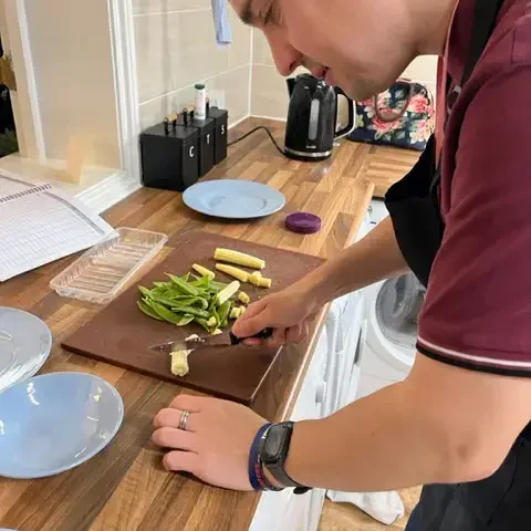 2) Person preparing food